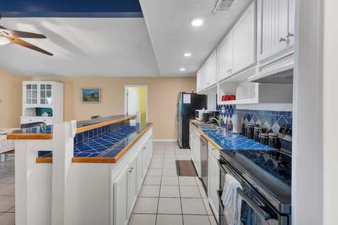 The large kitchen island opens up into the dining room for plenty of seating.