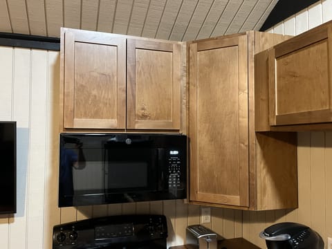 Microwave, oven and range full kitchen
