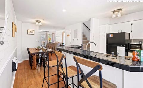 Countertop seating for 3 in kitchen area and additional 4-6 at dining table
