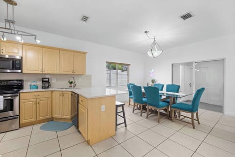 Gather and celebrate in style at the center of this vacation rental's dining area, where a chic bar cart awaits to elevate every occasion. Whether you're enjoying a meal with friends or crafting cocktails for a get-together, this space offers both elegance and warmth.
