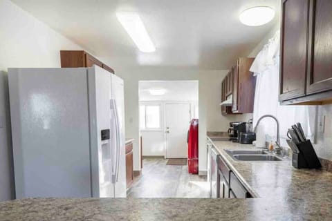 Open-concept living room view into the kitchen, view from the breakfast bar