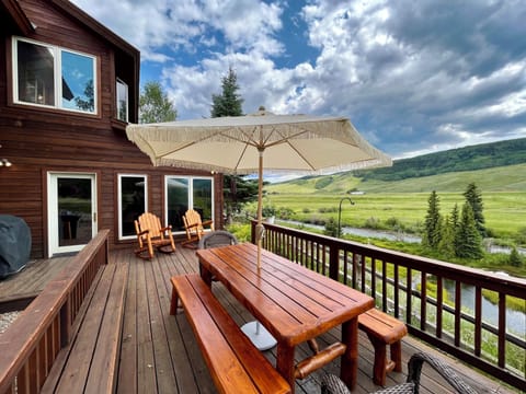 deck with expansive views of mountain and river
