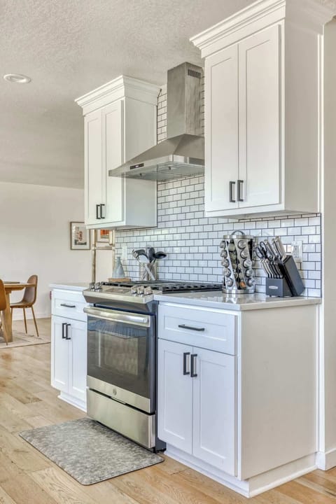 Bright white kitchen with a dishwasher! Easy cooking and cleanup for your stay.
