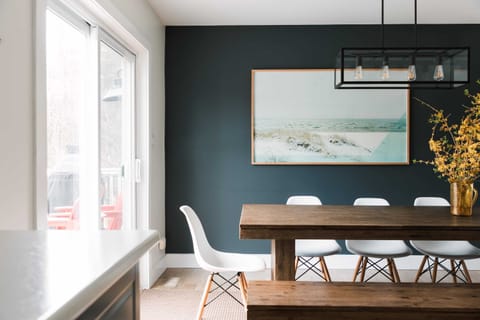 The Dining Room is next to the large patio doors leading to the fenced in outdoor oasis (includes hot tub, large swimming pool + outdoor shower).