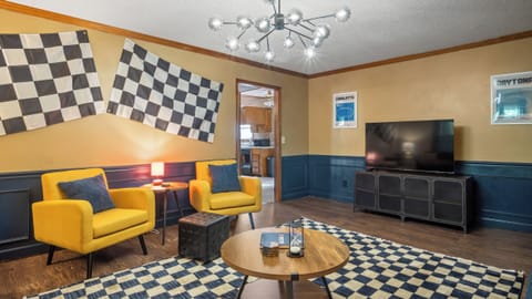 Living room with checkered theme and TV rack
