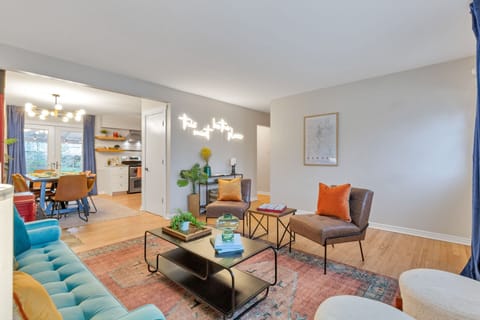 The foyer living room is in an open concept area with the dining area