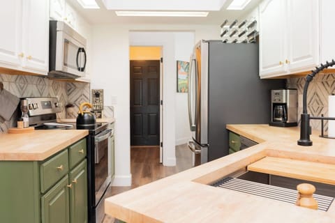 Well equipped kitchen for those of you who like to cook! Complete with utensils, pots & pans, dishes & serve ware. There is a tea kettle, drip coffee maker, keurig, blender, toaster, and crock-pot. The refrigerator has a filtered water line inside.