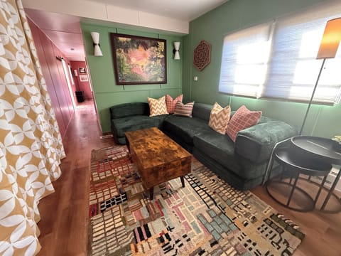 Artfully styled living space with cozy seating and colorful local decor