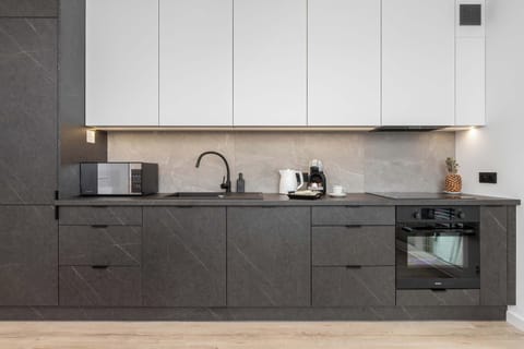 The fully equipped kitchenette includes everything you need for a home-cooked meal.