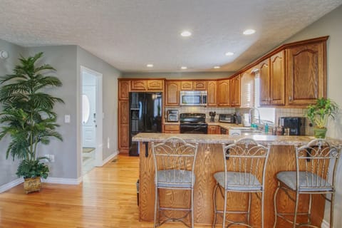 Stylish dining area with a seamless flow from the kitchen, perfect for serving meals fresh off the stove.