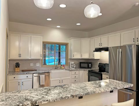 Kitchen is bright, functional and well stocked