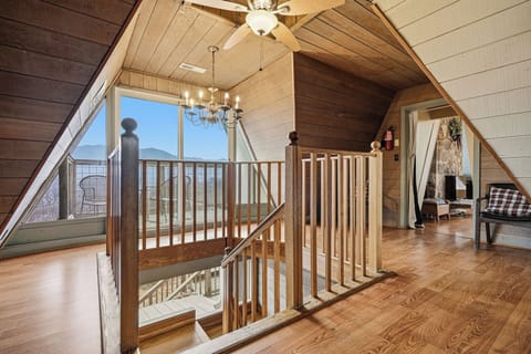 Warm wood floors and soaring ceilings create your perfect mountain retreat, with stunning lake views from every angle.