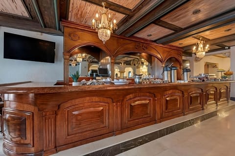 Pull up a stool and enjoy service at the gleaming bar.