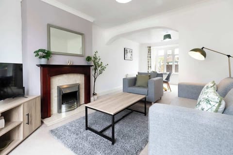 Relax in style with a spacious sofa and a comfy single chair in the lounge, ideal for winding down while enjoying the large TV
