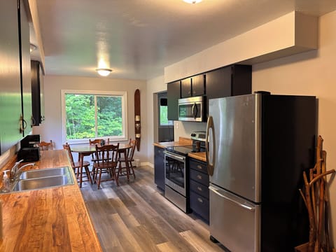 Large, fully-stocked kitchen.  