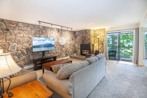 Updated floor plan living room with mountain and lake views