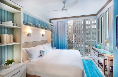 Wake up to sunlit comfort and captivating city views.
