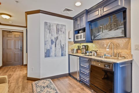 Kitchenette and flatscreen TV.