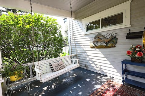 Enjoy the porch swing in this Victorian retreat
