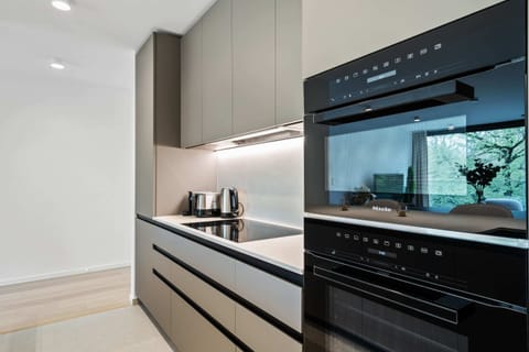 Craft your favorite meals in our sleek, fully equipped modern kitchen.
