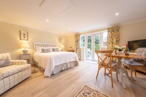 Little Redwings, Brancaster Staithe: King-size bed and access to the garden