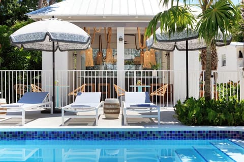 Relax with pool views while the bar buzzes nearby.
