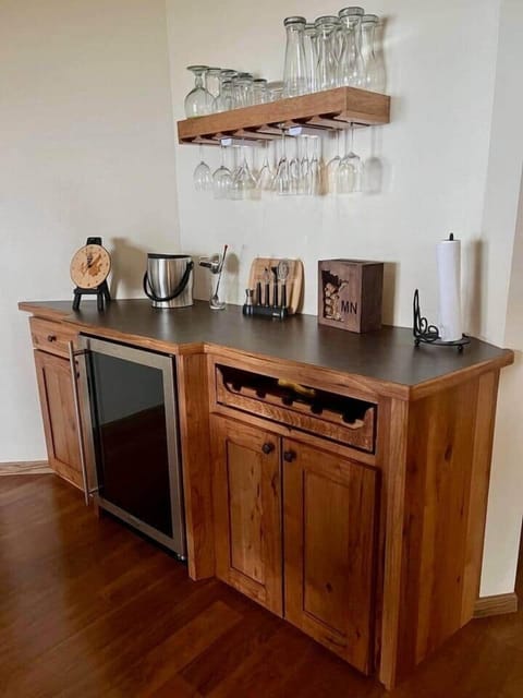 Beverage station with refrigerator is adjacent to dining table
