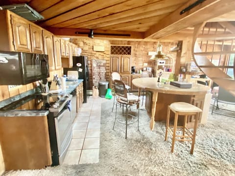 Kitchen area-please note high top sitting bar has been replaced with new bar