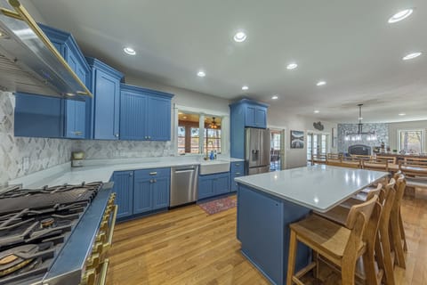 Custom kitchen with Z line gourmet gas stove with double oven