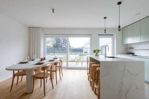 Open dining area and equipped kitchen