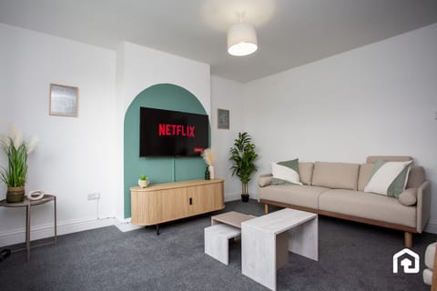 Step into the heart of our retreat and find solace in the inviting embrace of our living room. Sink into the plush cushions of our three-seater couch, where relaxation awaits after a day of adventure.