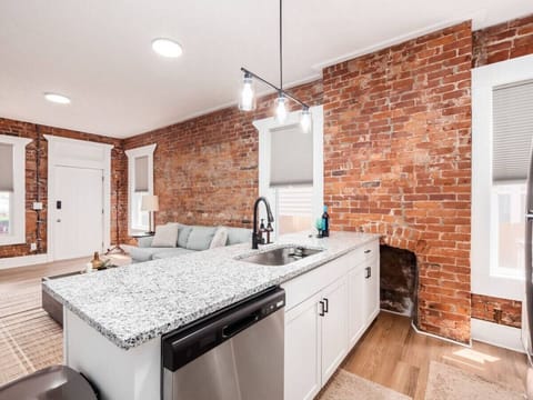 Fully Furnished Kitchen Open to Living Room