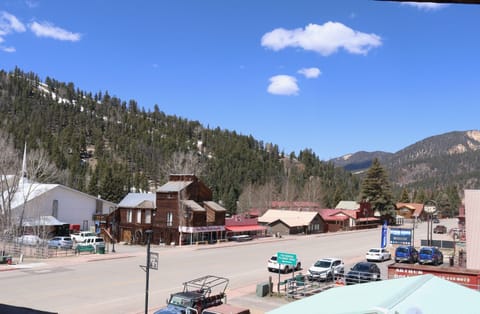 Charming mountain town surrounded by pine-covered peaks and winter snow patches. This scenic alpine community offers a peaceful retreat amid stunning natural beauty.