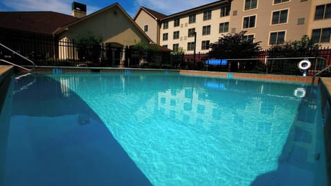 Soak up summer vibes beside the refreshing outdoor pool.