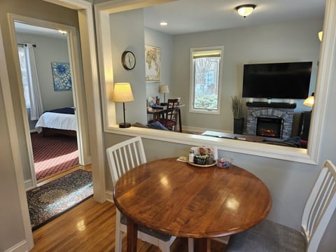 Kitchen table with views of living room and TV