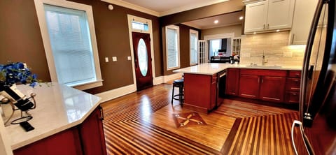 Another angle of the kitchen showing the original floors with detailed inlay!