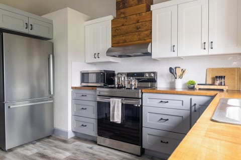 One of our favorite kitchen features is the 5-in-1 Microwave with air fryer, broiler, convection oven, and combination modes. Full instructions are available in the welcome guide when you arrive.