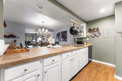 Full size kitchen featuring stainless steel appliances.