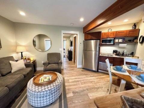 Notice the full kitchen Full size refridgerator, dishwasher, stove and microwave