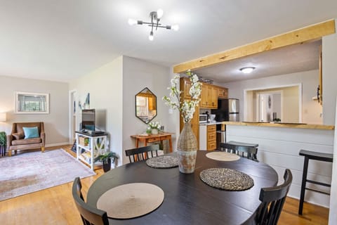 Gather around the table for meals and memories in this cozy dining area.