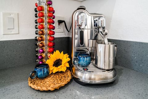 Waking up to fresh espresso from ocean-inspired mugs on your private patio. Enjoy the courtyard view and ocean breeze for a serene start to your day.