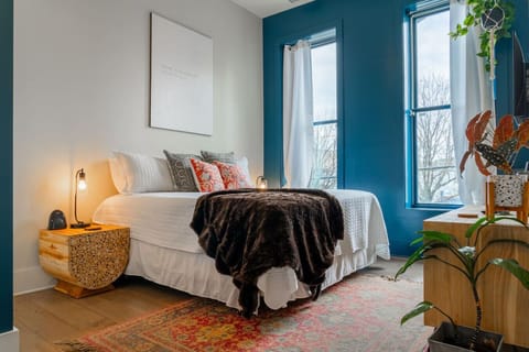 Relax in king-size comfort with crisp sheets and soft lighting.