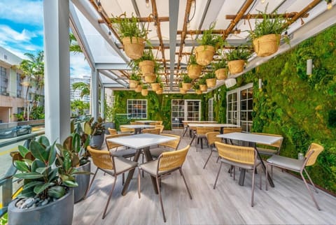 Savor open-air dining beside a lush living green wall.