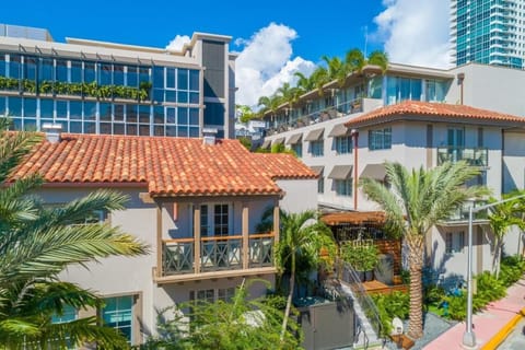 Soak up sunny resort vibes with palms and open walkways.