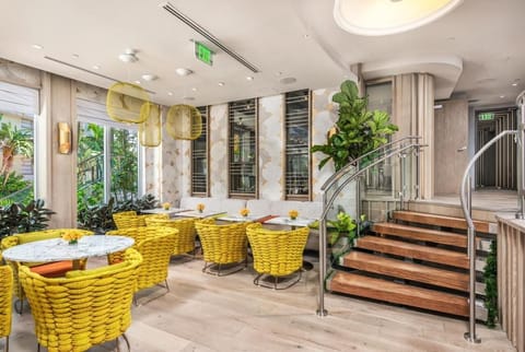 Unwind in sunny seating with bold textures and greenery.