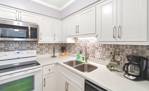 Kitchen offers a coffee pot and a dishwasher