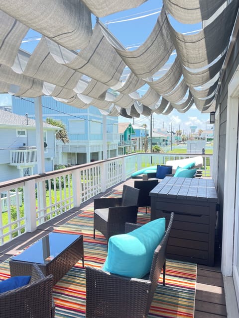 outdoor deck facing the ocean with retractable shades