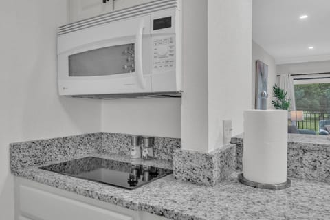 Microwave doubles as an oven as well & there is a two burner stovetop!