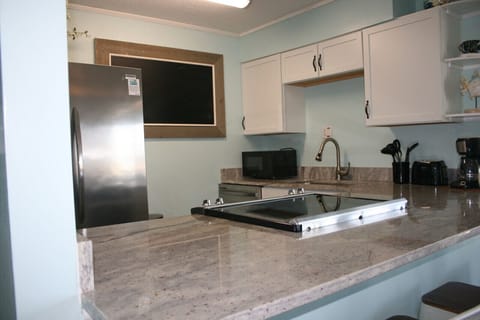 Stove top in kitchen.