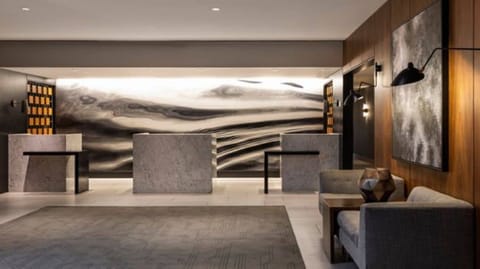 Step into a refined lobby with minimalist, modern design details.